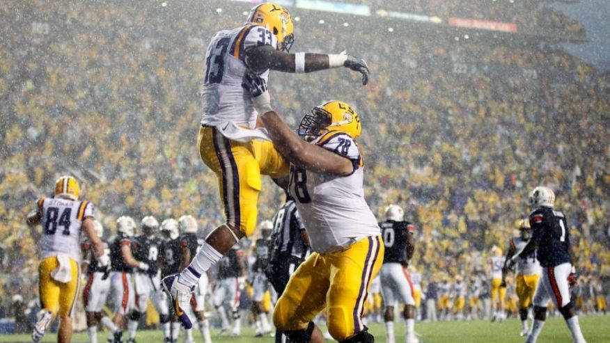 Sep 21 2013 Baton Rouge LA USA LSU Tigers running back Jeremy Hill celebrates with offensive tackle Vadal Alexander after a touchdown against the Auburn Tigers in the first quarter at Tiger Stadium. Mandatory Credit Crystal LoGiudice-USA T