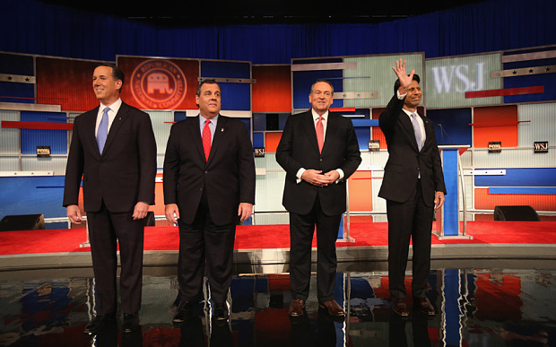 Presidential candidates Rick Santorum, New Jersey Governor Chris Christie Mike Huckabee and Louisiana Governor Bobby Jindal take the stage during the Republican Presidential Debate sponsored by Fox Business and the Wall Street Journal at the Milwa