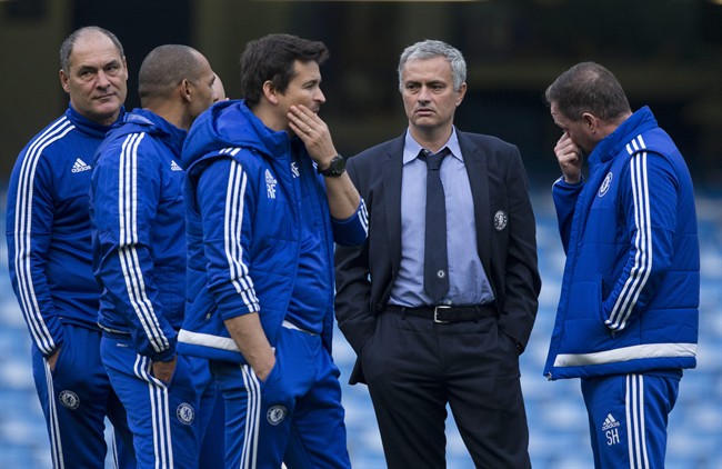 Chelsea's head coach Jose Mourinho second right talks with his coaching staff after coming back out onto the pitch after the English Premier League soccer match between Chelsea and Liverpool at Stamford Bridge stadium in London Saturday Oct. 31 2015