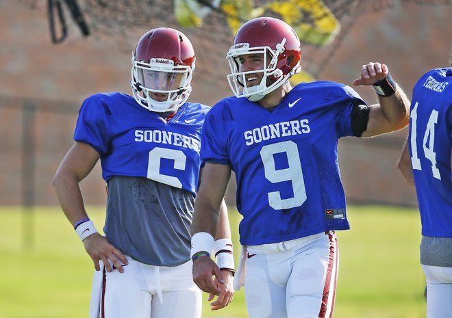 Oklahoma quarterbacks Baker Mayfield left and Trevor Knight talk during an Oklahoma NCAA college football practice in Norman Okla. The Big 12 championship could be decided by backup quarterbacks _ as could