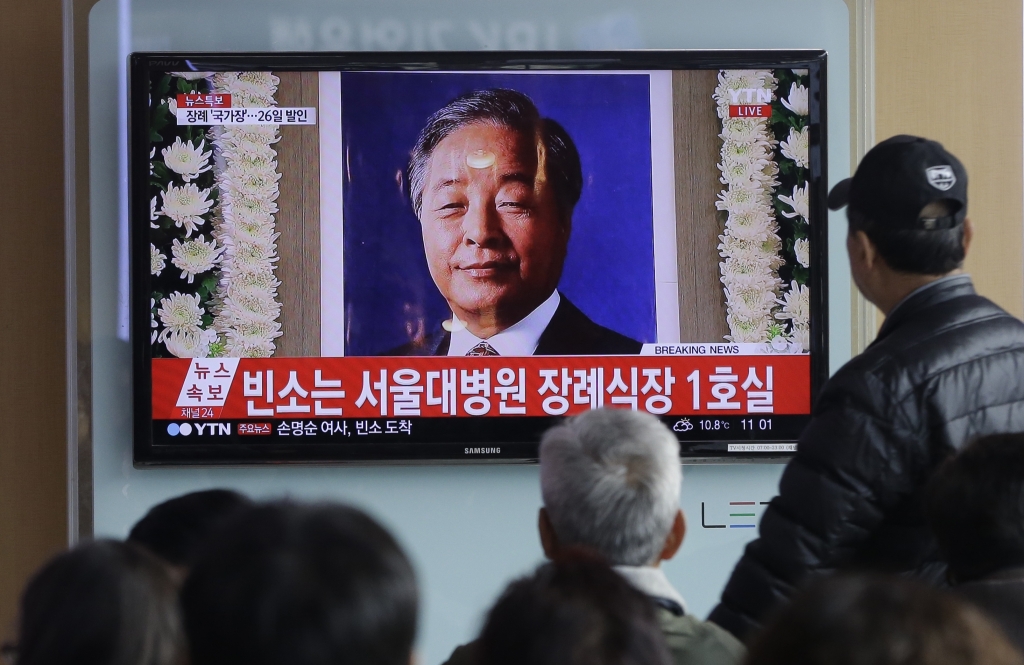 People watch TV news program showing a portrait of the late former South Korean President Kim Young-sam at Seoul Railway Station in Seoul South Korea Sunday Nov. 22 2015. Kim who formally ended decades of military rule in South Korea and accepted a