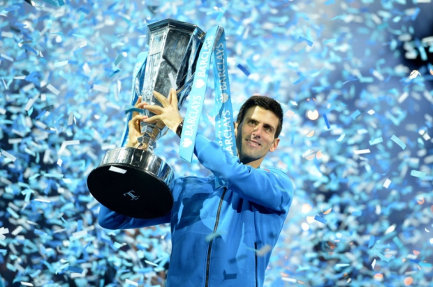 Novak Djokovic holds aloft the trophy after winning the final of the ATP World Tour Finals at the O2 Arena in London