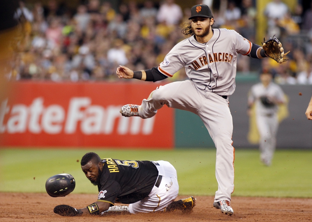 PITTSBURGH PA- AUGUST 21 Brandon Crawford #35 of the San Francisco Giants attempts a double play in the second inning during the game against Josh Harrison #5 of the Pittsburgh Pirates at PNC Park