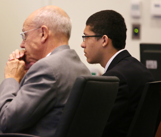 Philip Chism right appears in Salem Superior Court with one of his lawyers John Osler in Salem Mass. Monday Nov. 16 2015. Chism is accused of first