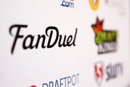 A Fan Duel logo is displayed on a board inside of the DFS Players Conference in New York