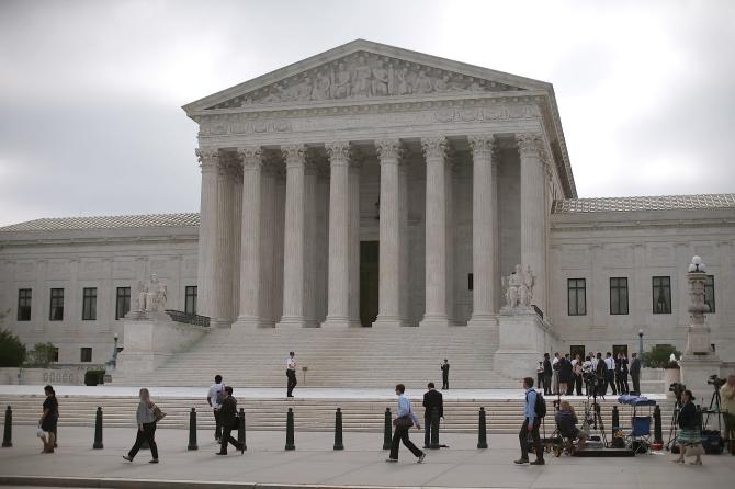 477570136-people-gather-in-front-of-the-supreme-court-building