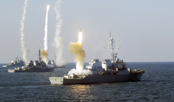 US Navy ships fire guided missiles during a naval exercise