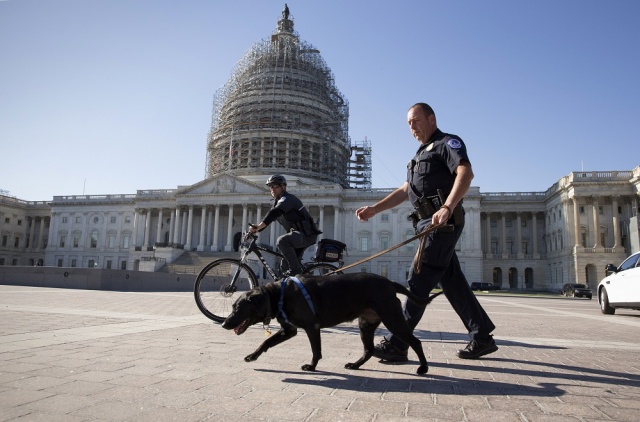 U.S. Capitol Police officers keep watch over the East Front of the Capitol as Congress prepares to return to work following the weekend terror attacks in Paris that killed 129 people in Washington Nov. 16