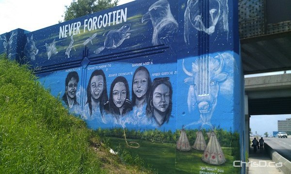 A mural on Portage Avenue shows the faces of missing and murdered aboriginal women as created by artist Tom Andrich