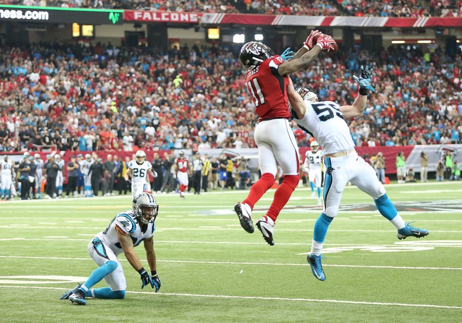 Atlanta wide receiver Julio Jones goes up and over Carolina linebacker Luke Kuechly to make the catch which he turned into a 70-yard scoring play and a 14-10 Falcons’ lead