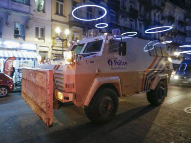 An armoured vehicle is seen while Belgian special forces patrol during a police raid in central Brussels Belgium