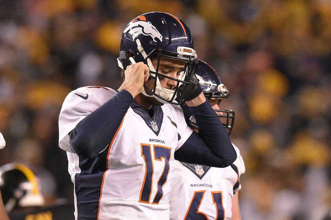 Denver Broncos quarterback Brock Osweiler walks off the field during the second half of an NFL football game against the Pittsburgh Steelers in Pittsburgh Sunday Dec. 20 2015. The Steelers won 34-27