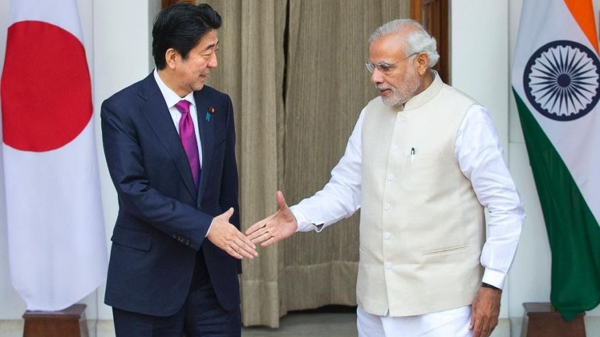 Indian Prime Minister Narendra Modi right and his Japanese counterpart Shinzo Abe are about to shake hands before their meeting in New Delhi India Saturday Dec. 12 2015. Modi hopes the visit of Abe will be a major step in transforming India into