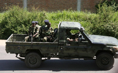 Burundi military personnel drive through the Musaga neighbourhood of Bujumbura