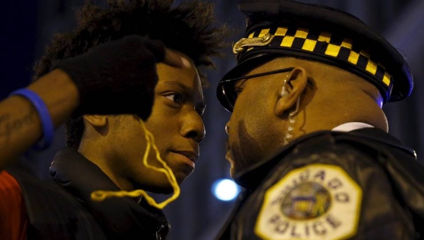 Protester Lamon Reccord 16 confronted a police officer during a demonstration in response to the fatal shooting of Laquan Mc Donald in Chicago on Wednesday