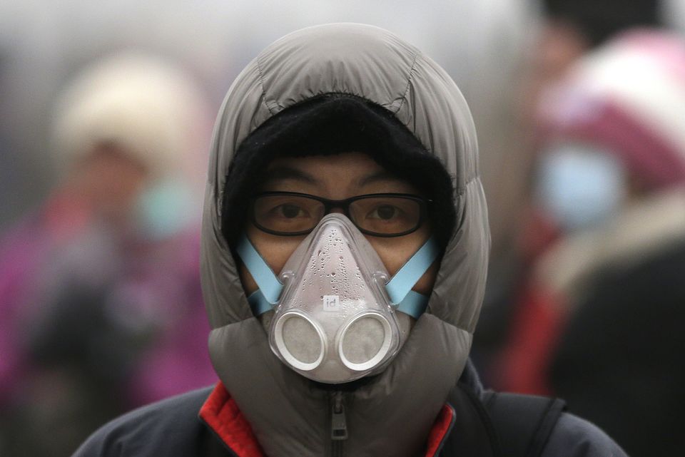 Beijingers make fashion statements with masks in the smog