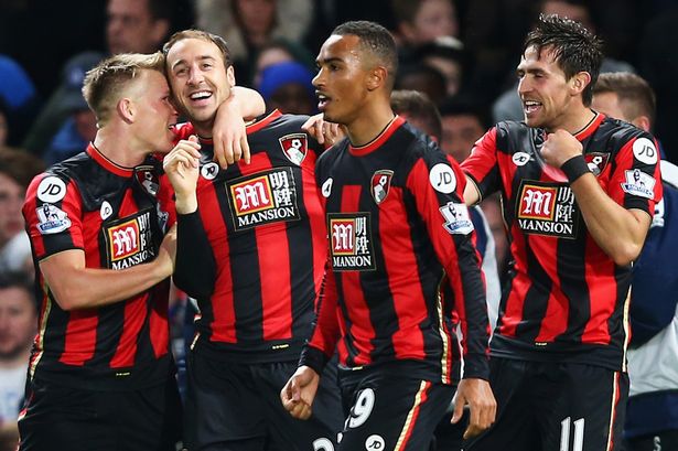 Glenn Murray celebrates scoring the first goal with his team mates