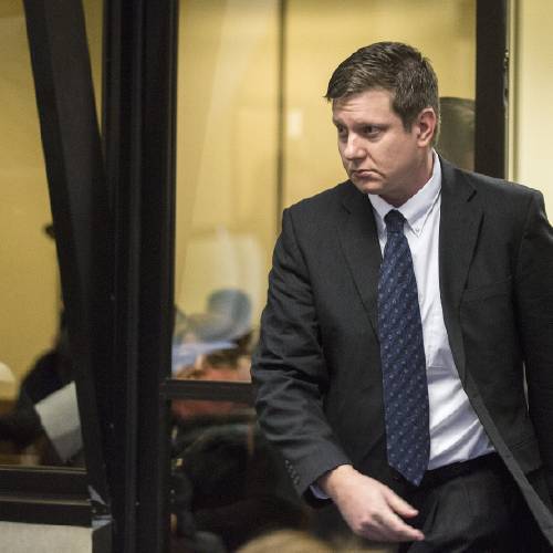 Officer Jason Van Dyke arrives for a court hearing at the Leighton Criminal Court Building in Chicago on Friday Dec. 18 2015. It was Van Dyke’s first appearance in court since a grand jury indicted him on Wednesday Dec. 16. He