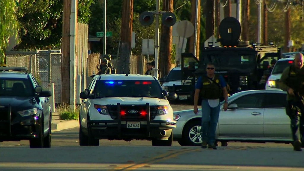 The hunt for one to three suspects is taking place near a San Bernardino California center for people with developmental disabilities where at least 14 people were killed Wednesday Police Chief Jarrod Burguan told reporters