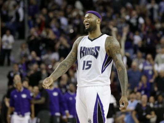 Sacramento Kings forward De Marcus Cousins celebrates after teammate