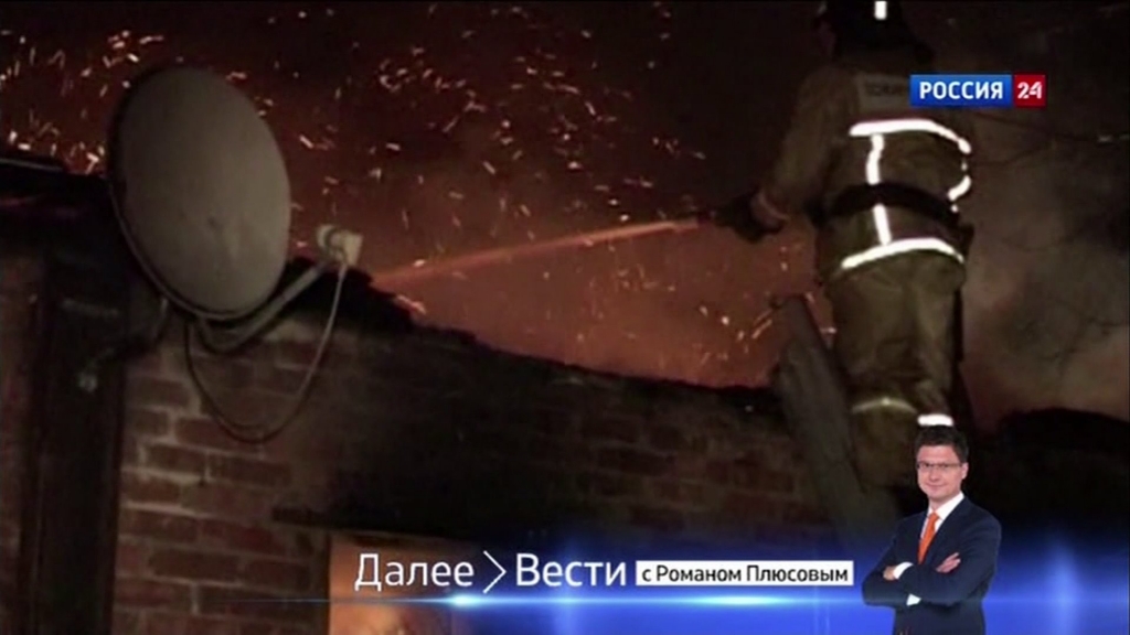 Firemen work to put out a blaze at a Russian hospital