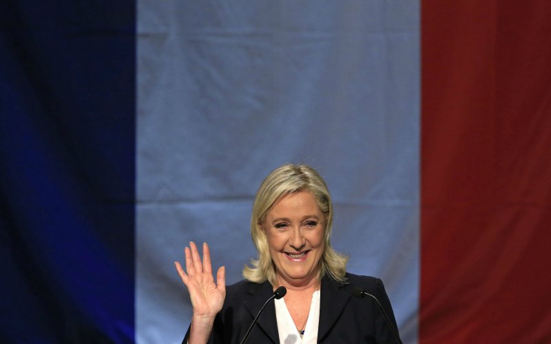 French National Front political party leader and candidate Marine Le Pen arrives to deliver her speech after the announcement of the results during the first round of the regional elections in Henin-Beaumont France