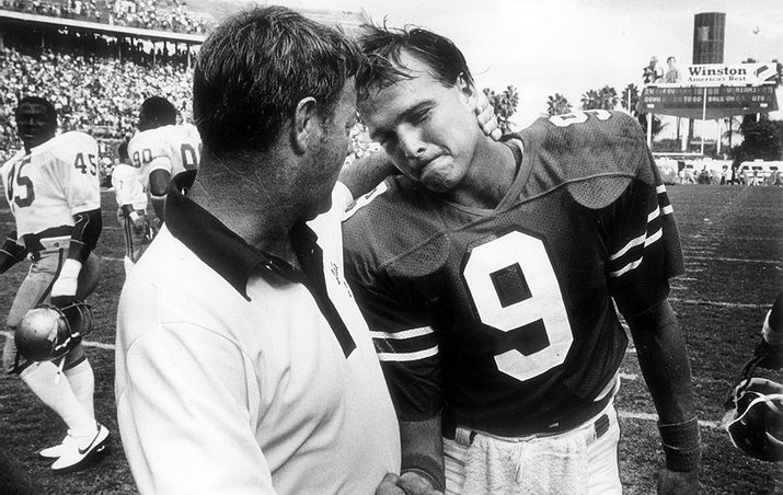 Florida State coach Bobby Bowden consoles Miami quarterback Mark Richt after UM’s 24-7 loss to Florida State in 1982