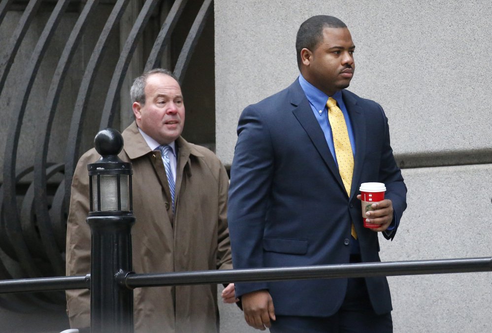 William Porter right one of six Baltimore city police officers charged in connection to the death of Freddie Gray walks into a courthouse with his attorney Joseph Murtha for jury selection in his trial Monday in Baltimore