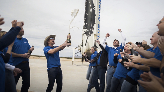 Blue Origin billionaire founder Jeff Bezos and team members celebrate after the successful first spaceflight and landing of its New Shepard spacecraft and booster. The test flight launched from West Texas on Nov. 23 2015