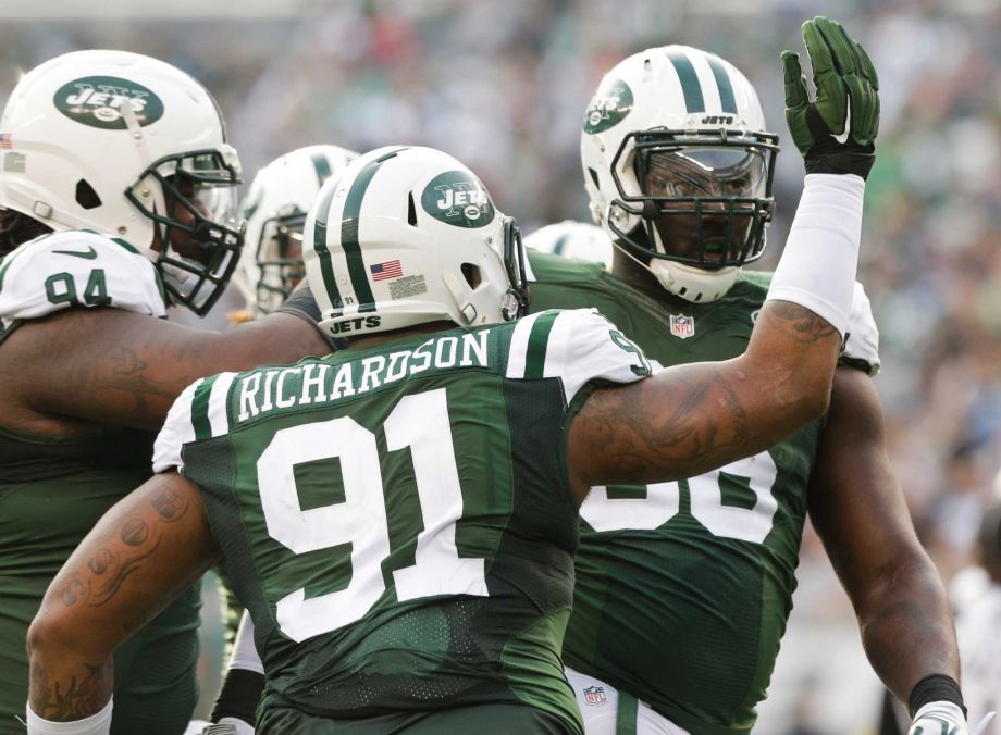 New York Jets defensive end Muhammad Wilkerson celebrates a sack with teammates during the first half of an NFL football game against the Tennessee Titans Sunday Dec. 13 2015 in East Rutherford N.J