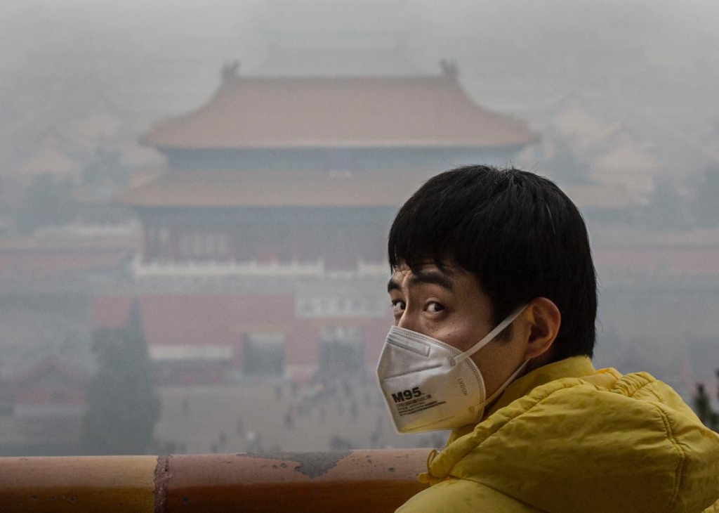 500412598-chinese-man-wears-a-mask-to-protect-against-pollution