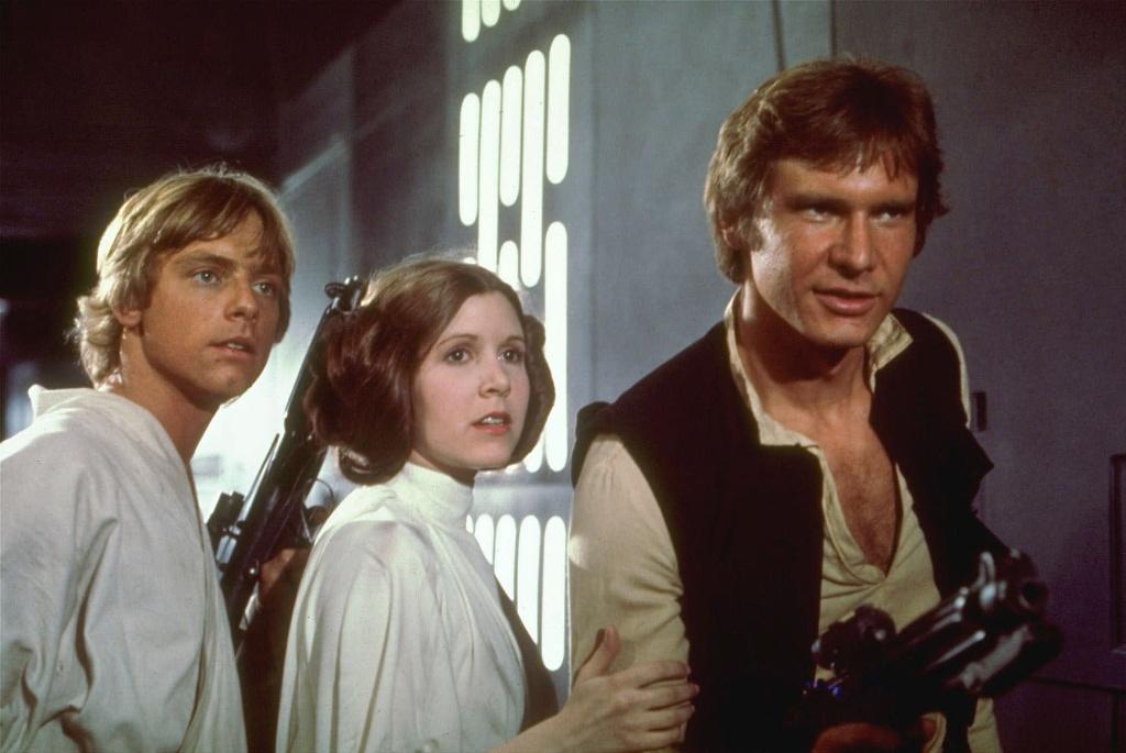 Mark Hamill left Carrie Fisher center and Harrison Ford right are shown in a scene from the 1977 film'Star Wars