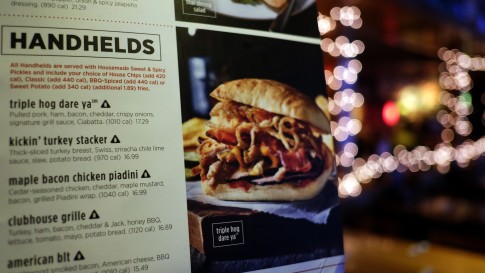 That black triangle icon is a sodium warning label next to a dish on the menu at an Applebee's in New York City. Starting Tuesday the city's Health Department is requiring chain restaurants with 15 or more locations to display the salt shaker