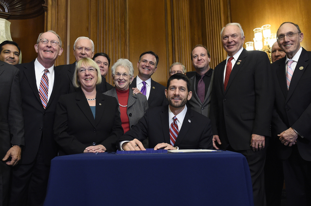 House Speaker Paul Ryan of Wis. prepares to sign legislation on Capitol Hill in Washington Wednesday Dec. 9 2015 that changes how the nation's public sch