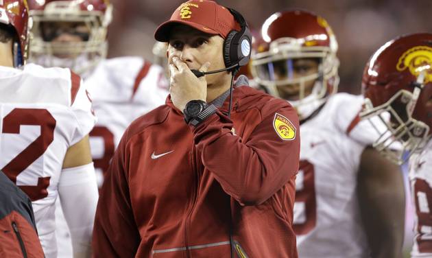 Southern California head coach Clay Helton center reacts during the first quarter of a Pac-12 Conference championship NCAA college football game against Stanford Saturday Dec. 5 2015 in Santa Clara Calif