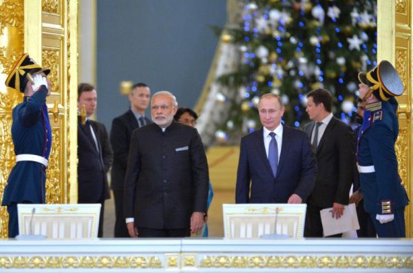 Russian President Vladimir Putin foreground right and Indian