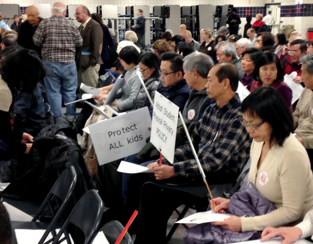 Parents pack the high school cafeteria in anticipation of the District 211 school board decision yesterday. Many were angered by the agreement but supporters were also in attendance