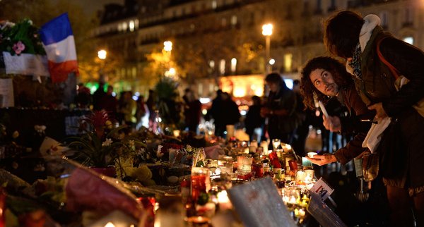 In Paris´ Republic Square people were lighting candles Friday in memory of the scores of victims killed in the terrorist attacks a week earlier. PASCAL LE SEGRETAIN /Getty Images