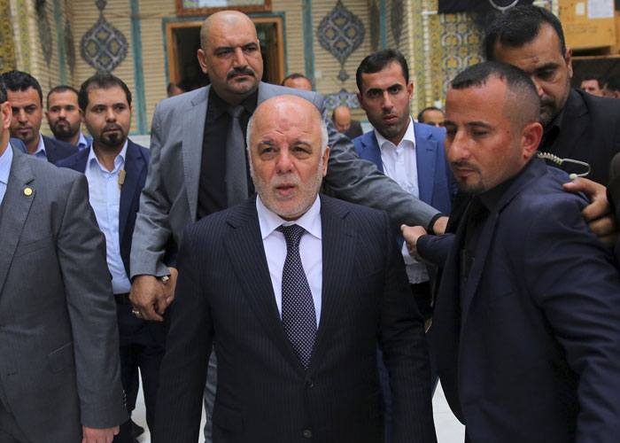 Iraq Prime Minister Haider al-Abadi center shown here on Nov. 7 said his troops can defeat ISIS without the help of foreign fighters