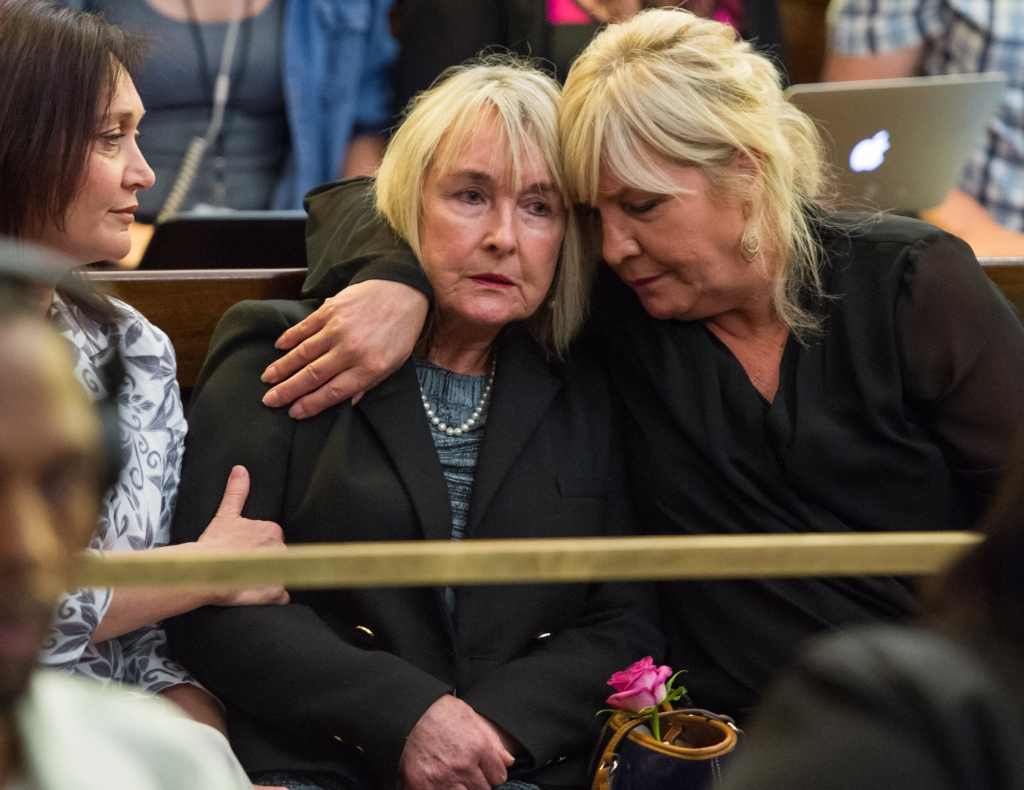 RELIEF June Steenkamp centre mother of Reeve Steenkamp is comforted as the judge delivers verdict