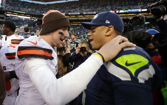 Russell Wilson right and Cleveland Browns quarterback Johnny Manziel talk after an NFL football game Sunday Dec. 20 2015 in Seattle. The Seahawks won 30-13