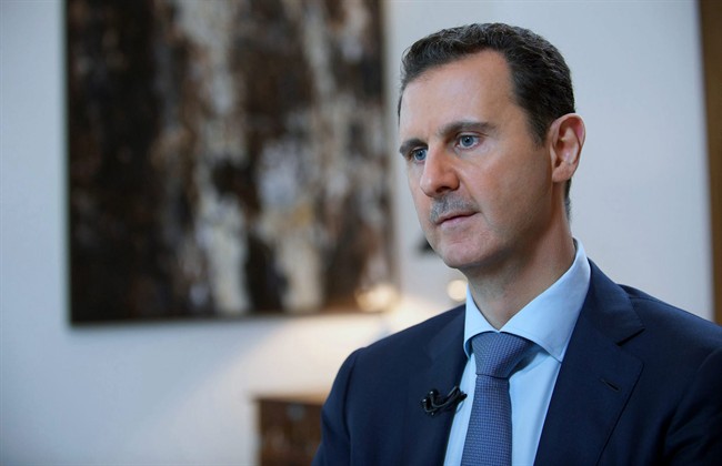 Syrian official news agency SANA shows Syrian President Bashar Assad speaking during an interview with the Iran's Khabar TV in Damascus Syria