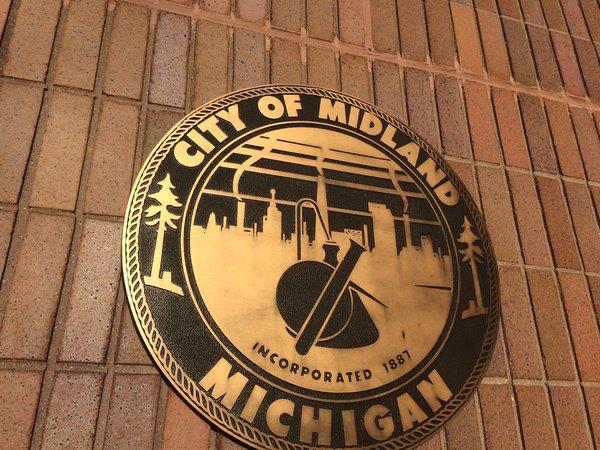 The city of Midland has a long history with Dow Chemical as its city seal shows