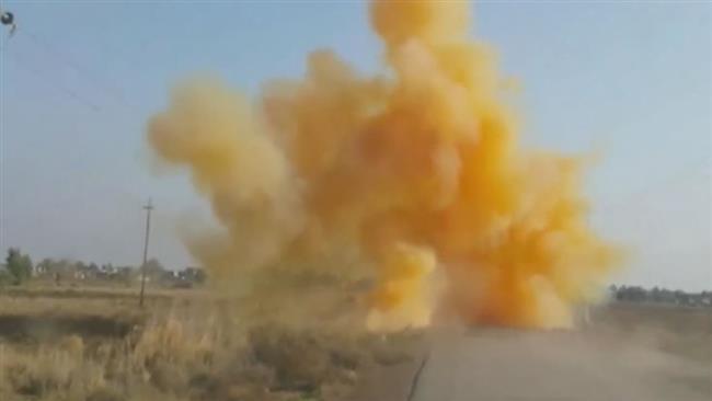 The image grab shows a crude roadside bomb filled with toxic chlorine gas being detonated by bomb disposal teams in Iraq