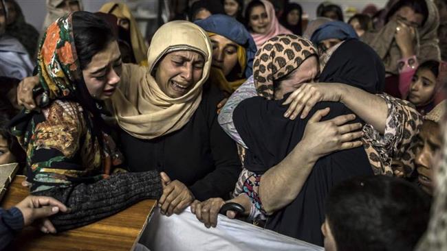 The relatives of a boy killed in a last December attack on a school in Pakistan's Peshawar mourn for him