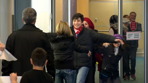 Tima Kurdi greets her brother's family who she is privately sponsoring as refugees in B.C. at Vancouver International Airport on Monday