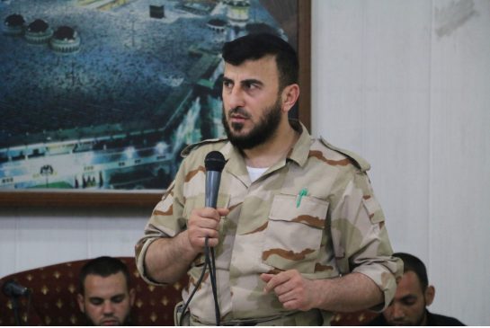 Zahran Alloush head of one of the most powerful Saudi-backed insurgent groups fighting against President Bashar Assad’s government speaks during the wedding of a fellow fighter in July. An airstrike on Friday near the Syrian capital of Damascus killed