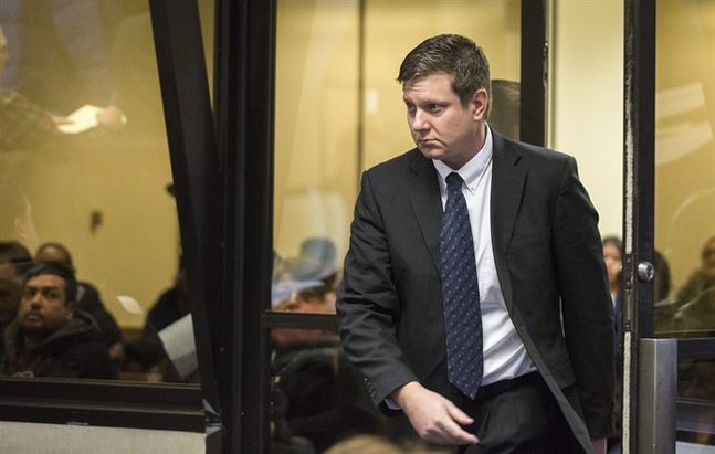 Chicago police Officer Jason Van Dyke arrives for a court hearing at the Leighton Criminal Court Building in Chicago on Friday Dec. 18 2015. It was Van Dyke’s first appearance in court since a grand jury indicted him on Wednesday Dec. 16. He faces