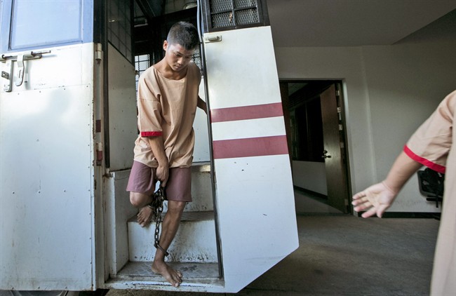 Myanmar migrant Zaw Lin centre arrives at court in Koh Samui Thailand Thursday Dec. 24 2015