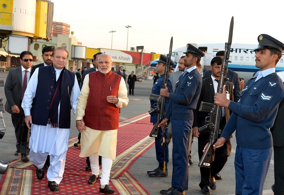 Pakistani Prime Minister Nawaz Sharif greets his Indian counterpart Narendra Modi with an honor guard at the airport in Lahore Pakistan